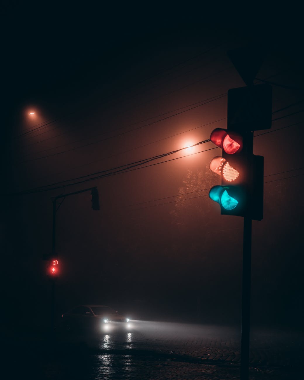 traffic light on road at night