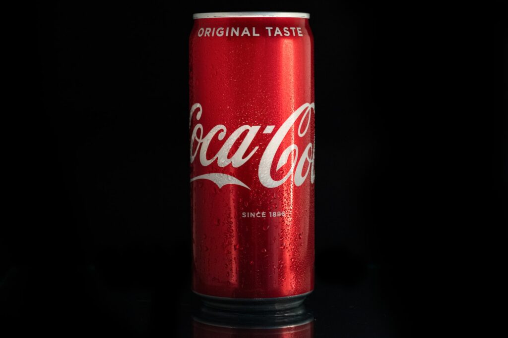coca cola can on black surface